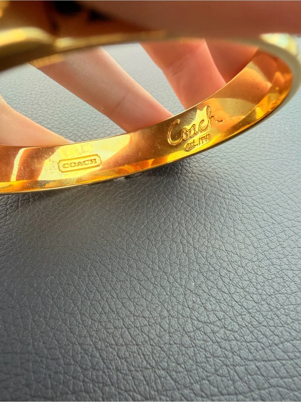 Coach Gold-Tone Bracelet with Black Enamel Signature Pattern